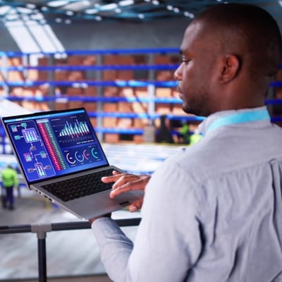 Engineer Worker Using Warehouse Automation Dashboard